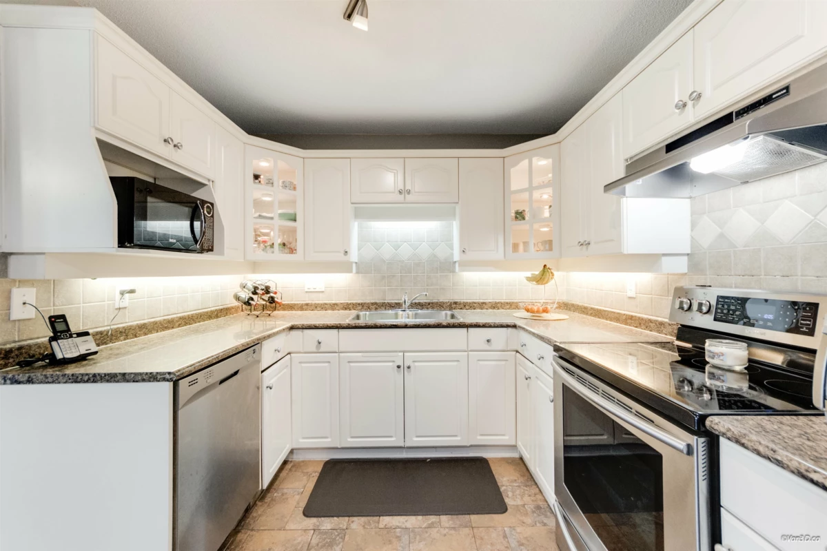 Living Room Photo of 203 17740 58a Avenue, Surrey, BC