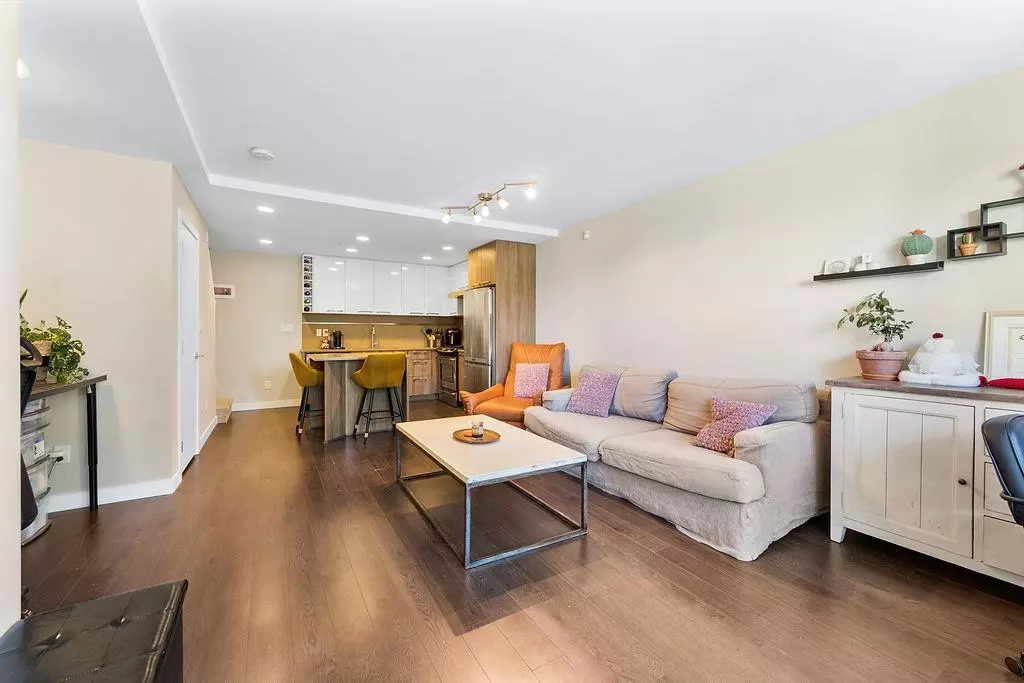 Living Room Photo of 104 9350 University High Street, Burnaby, BC