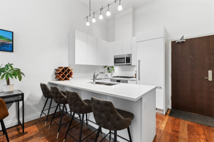 Kitchen Island Photo of 104 199 Victory Ship Way, North Vancouver, BC